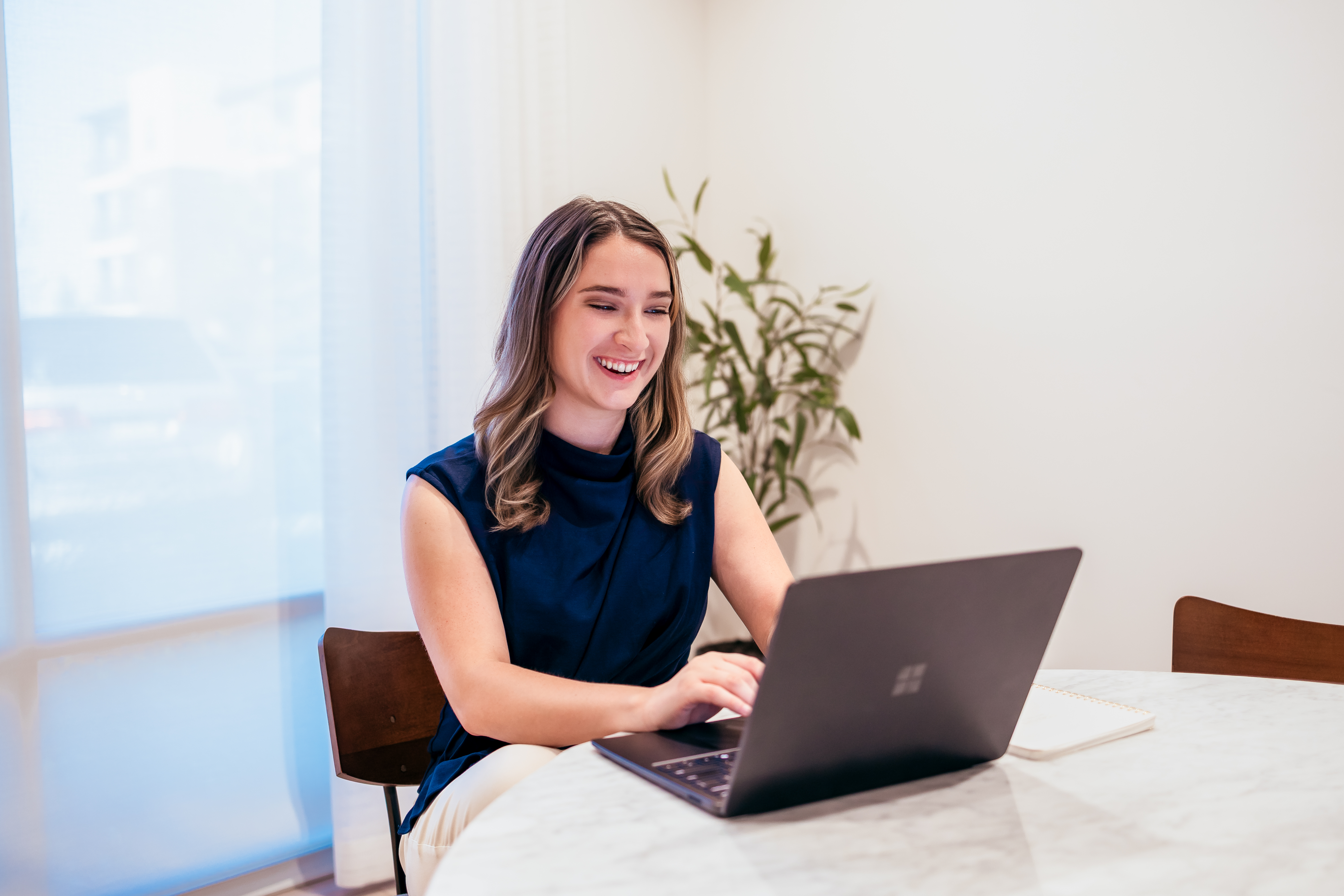 Trinity Miller-Aragon working at her laptop